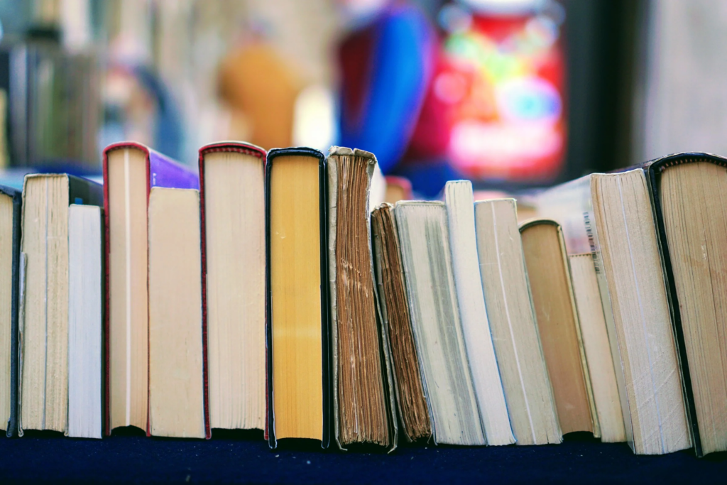 Books stacked spine-up on a horizontal surface